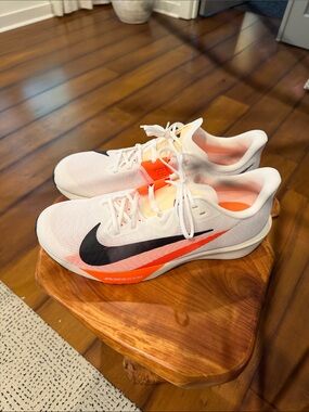 Nike White Running Shoes with carbon plate Black Swoosh and Neon Orange Details